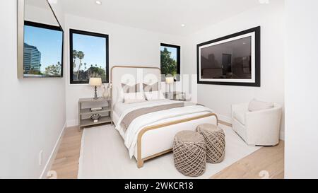 A modern, cozy, spacious bedroom with a king-size bed Stock Photo