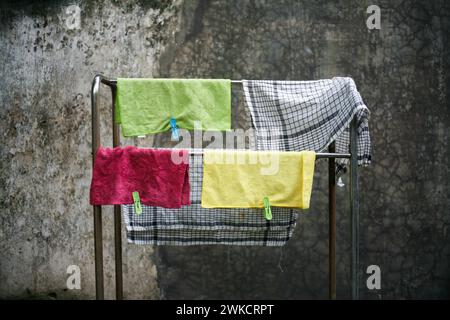 Duster cloth and rags hanging on a towel rack Stock Photo