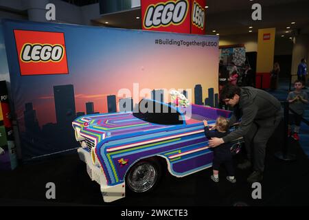 Toronto, Canada. 19th Feb, 2024. People are looking at a car made of LEGO bricks at the Canadian International Auto Show in Toronto, Canada, on February 19, 2024. (Photo by Arrush Chopra/NurPhoto) Credit: NurPhoto SRL/Alamy Live News Stock Photo