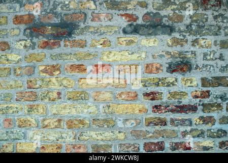 A pastel painted old brick wall. Stock Photo
