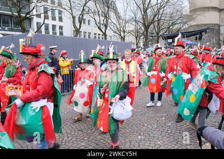 Cologne, Germany - February 11, 2024  Funny Street musicians in colorful clothes celebrating the women's carnival, Rosenmontag Parade( the rose monday. Stock Photo