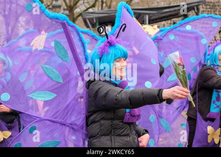 Cologne, Germany - February 11, 2024  Funny Street musicians in colorful clothes celebrating the women's carnival, Rosenmontag Parade( the rose monday. Stock Photo