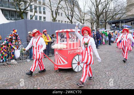 Cologne, Germany - February 11, 2024  Funny Street musicians in colorful clothes celebrating the women's carnival, Rosenmontag Parade( the rose monday. Stock Photo