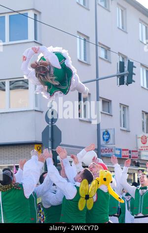 Cologne, Germany - February 11, 2024  Funny Street musicians in colorful clothes celebrating the women's carnival, Rosenmontag Parade( the rose monday. Stock Photo