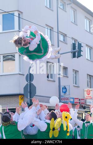 Cologne, Germany - February 11, 2024  Funny Street musicians in colorful clothes celebrating the women's carnival, Rosenmontag Parade( the rose monday. Stock Photo