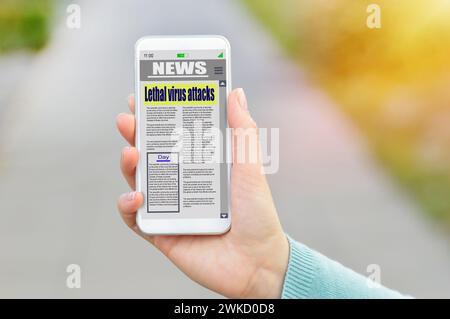 Online news in mobile phone. Close up of smartphone screen. Woman reading articles in application. Hand holding smart device. Mockup website. Newspape Stock Photo