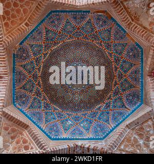 Thatta, Sindh, Pakistan - 11 17 2019 : View of octagonal floral and geometric blue mosaic design inside dome at ancient Shah Jahan mosque Stock Photo