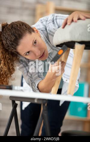 woman working in upholstery workshop Stock Photo
