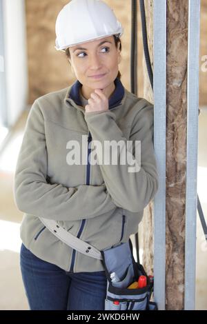 woman builder is thinking about something Stock Photo