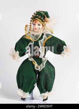 Garham, Germany. 19th Feb, 2024. Porcelain Italian doll depicting the hero of the Commedia Dell'arte in a green suit. Porcelain dolls appeared in the 18th century in France. Credit: SOPA Images Limited/Alamy Live News Stock Photo
