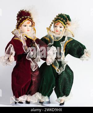 Garham, Germany. 19th Feb, 2024. Two Porcelain Italian dolls depicting the hero of the Commedia Dell'arte in red and green costumes. Porcelain dolls appeared in the 18th century in France. Credit: SOPA Images Limited/Alamy Live News Stock Photo