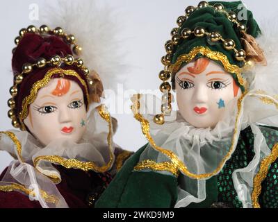 Garham, Germany. 19th Feb, 2024. Two Porcelain Italian dolls depicting the hero of the Commedia Dell'arte in red and green costumes. Porcelain dolls appeared in the 18th century in France. (Photo by Igor Golovniov/SOPA Images/Sipa USA) Credit: Sipa USA/Alamy Live News Stock Photo