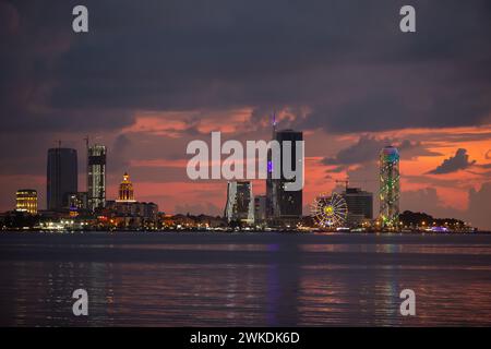 August 07, 2022. Georgia. Batumi in the evening in colorful lights from the sea. Beautiful coastal night city. Stock Photo