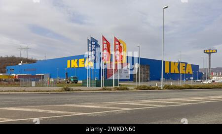 Belgrade, Serbia - February 10, 2024: Colour Flags in Front of Large Ikea Scandinavian Furniture Store. Stock Photo