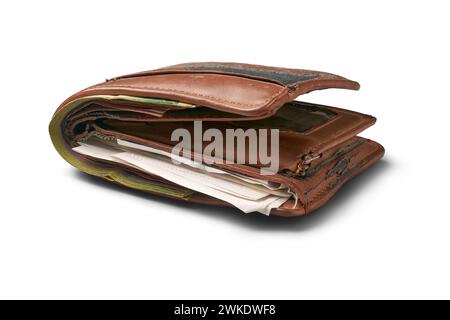 old worn out wallet with papers, receipts and cash inside, years of used broken and faded leather, frayed edges and scuffed surfaces, deteriorated Stock Photo