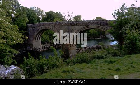 The River Lune and Devil's Bridge at Kirby Lonsdale in Cumbria, UK. Built in 12th or 13th century, iIt is a popular meeting place for motorcyclists Stock Photo