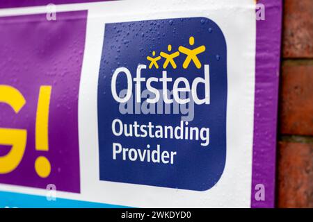 London. UK- 02.18.2024. A banner outside a school displaying the government school body Ofsted rating it as an outstanding provider. Stock Photo