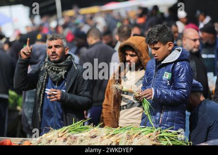 (240220) -- DEIR EL-BALAH, Feb. 20, 2024 (Xinhua) -- People shop at a market in central Gaza Strip city of Deir el-Balah, Feb. 19, 2024. (Xinhua) Stock Photo