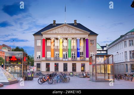 Danske Bank headquarter located in historic building of Erichsen Mansion at Kongens Nytorv in Copenhagen with columns decorated in rainbow colors, Den Stock Photo