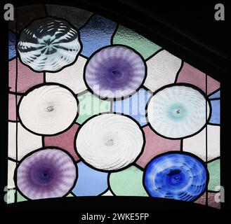 Spain. Barcelona. Casa Batlló. Remodel by Gaudí, 1904-1906. Stained glass window close-up. Saloon noble floor. Stock Photo