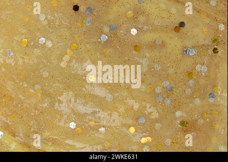 Colorful yellow slime texture background close up view Stock Photo