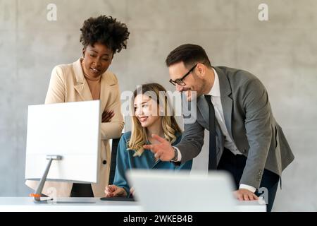 Group of diverse multiethnic business people and software developers working as a team in office Stock Photo