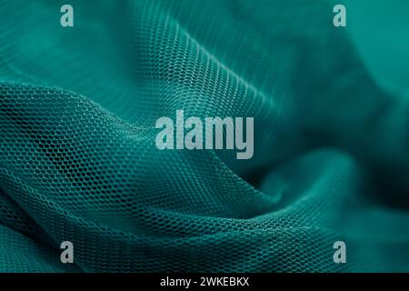 The green fabric against a dark background Stock Photo