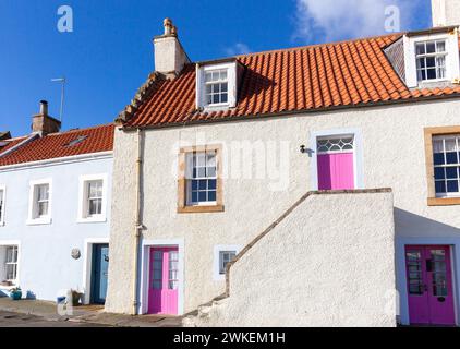 Bright pink doors on a traditional house in St Monans, Fife, Scotland Stock Photo