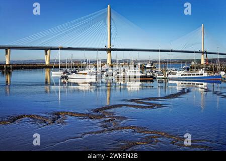 UK, Scotland, South Queensferry, Port Edgar Marina and Queensferry Crossing over the Firth of Forth. Stock Photo