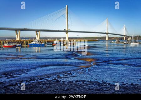 UK, Scotland, South Queensferry, Port Edgar Marina and Queensferry Crossing over the Firth of Forth. Stock Photo