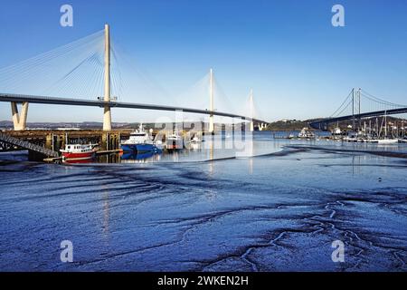 UK, Scotland, South Queensferry, Port Edgar Marina Jetty, Queensferry Crossing and Forth Road Bridge over the Firth of Forth. Stock Photo