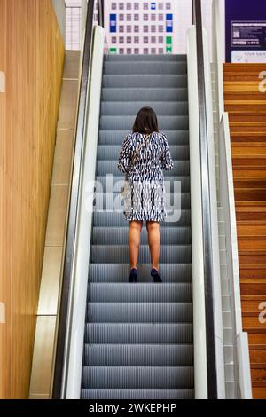 Visitor to the fair going up escalators, BEC, Bilbao Exhibition Center, Basque Country, Spain Stock Photo