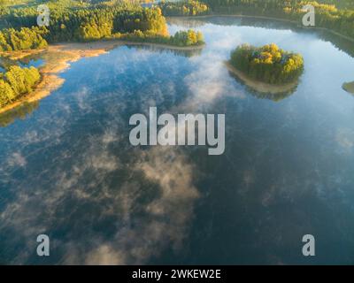 Aerial view of Heart Eater Island on Krzywa Kuta lake in autumn colors, Mazury, Poland Stock Photo