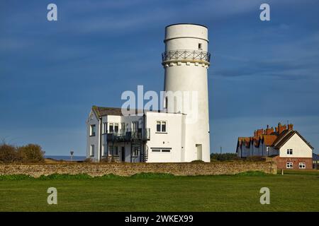 Lighthouse Close, Old Hunstanton, Norfolk, England, UK - The decommissioned lighthouse on the clifftop is now a holiday let. Stock Photo