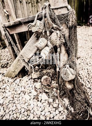 Old fishermans net hung our to dry in Devon. Stock Photo