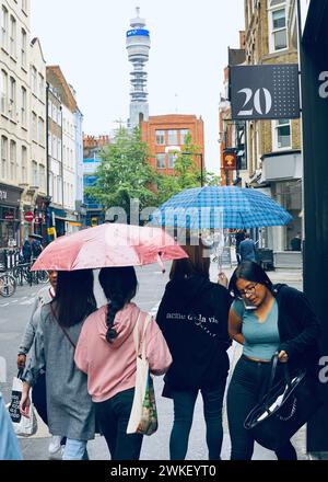A very wet day in central London on a busy Friday morning on their way to work and going shopping. Stock Photo