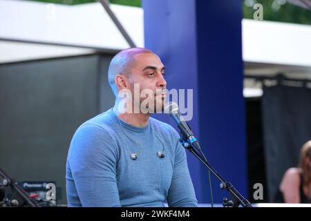 London, UK. 25 June 2022. Rapper Lowkey (Kareem Dennis) performs to welcome Little Amal, a 3.5 meter tall puppet, on Southbank. © Waldemar Sikora Stock Photo