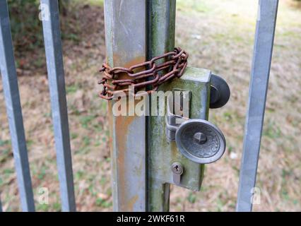 old rusty chain on a metal gate Stock Photo