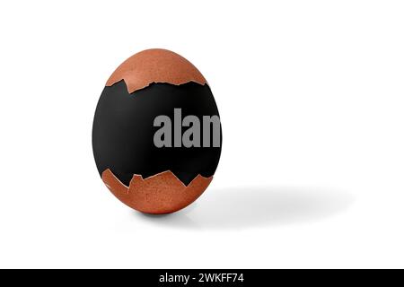 Half shelled boiled Easter chicken egg painted in black mourning color isolated on a white background Stock Photo