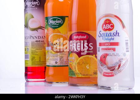 closeup, Fresh fruit drink bottle display on the bottle. Indonesian brand fruit syrup in a bottle. A drink that is perfect for summer. isolated white Stock Photo