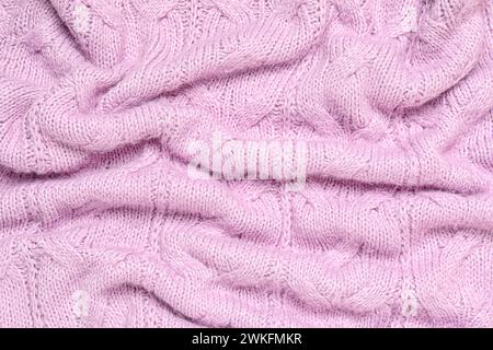 Texture of stylish knitted fabric with folds as background Stock Photo