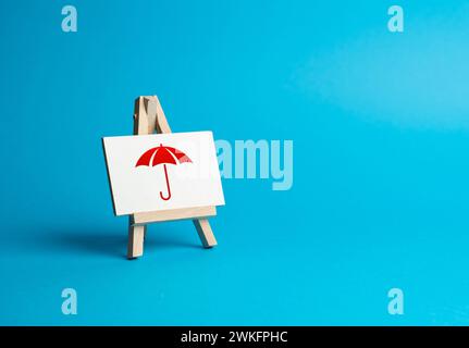Red umbrella on a sign. Insurance and protection concept. Insurance products services. Coverage for areas of risk, including life, health, auto, home, Stock Photo