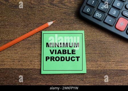 Concept of Minimum Viable Product write on sticky notes isolated on Wooden Table. Stock Photo