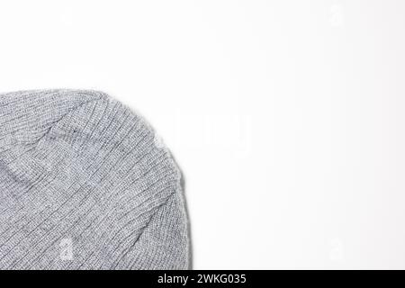 Grey wool fabric knitted lying on white background with space for text Stock Photo