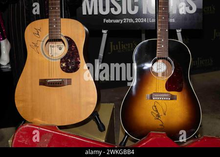 Gardena, USA. 20th Feb, 2024. JOHNNY CASH | SIGNED AND PERSONALLY OWNED BENTLY ACOUSTIC GUITAR and WILLIE NELSON | SIGNED GIBSON J-45 STANDARD GUITAR is previewed before auction at Julien's Auctions in Gardena, CA on February 20, 2024. Julien's Auctions will present over 20 pieces of street art by Banksy, Jules Muck and more at the “Street Art” auction on Thursday, February 22, 2024 and over 100 pieces of rock and roll history from Dolly Parton, Taylor Swift and more at the “Music Icons” auction on Tuesday, February 27, 2024. (Photo by Corine Solberg/SipaUSA) Credit: Sipa USA/Alamy Live News Stock Photo