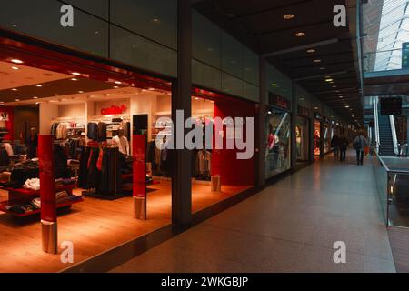 Celio Clothes store at Gare St Lazare shopping mall, Paris, France | Modern clothing store front in a shopping mall with glass facade and interior lig Stock Photo