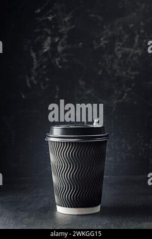 Paper coffee cup with cap mockup on dark background. take away coffee cup mockup,  paper coffee cup. To go coffee cup  for web design. Take coffee wit Stock Photo