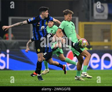Milan. 20th Feb, 2024. Inter Milan's Alessandro Bastoni (L) vies with Atletico Madrid's Marcos Llorente during the UEFA Champions League Round of 16 1st leg match between Inter Milan and Atletico Madrid in Milan, Italy, Feb.20, 2024. Credit: Alberto Lingria/Xinhua/Alamy Live News Stock Photo