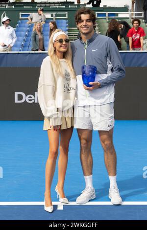 Delray Beach, FL, USA. 19th Feb, 2024. Morgan Riddle poses with Taylor Fritz (USA) after he wins the 2024 Delray Beach Open on February 19, 2024, at the Delray Beach Tennis Center in Delray Beach, Florida. Credit: Andrew Patron/Media Punch/Alamy Live News Stock Photo