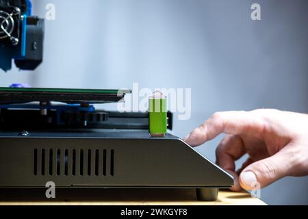 Hand touching screen of a 3d printer Stock Photo